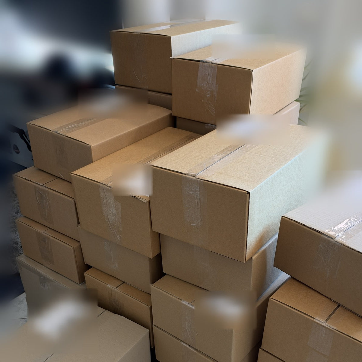 Packed Drop Store parcels stacked and labelled, ready for courier pickup