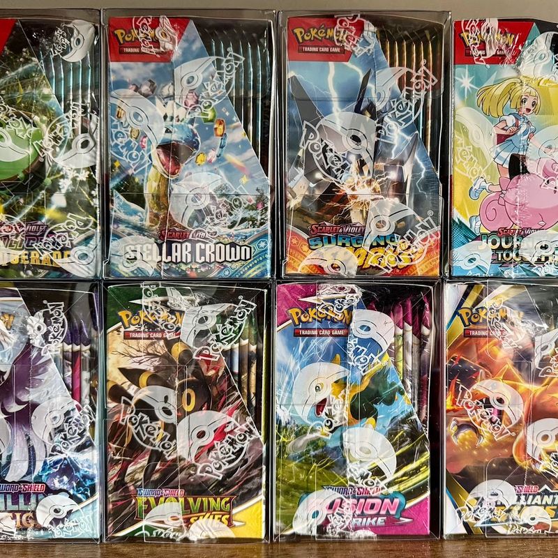 Customer's shelf of Pokemon booster boxes in protective cases, including the Fusion Strike box bought from Drop Store