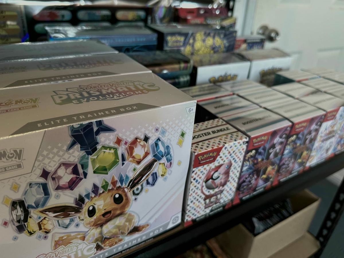 Sealed Pokemon TCG products on the shelf at Drop Store Collectables in Melbourne: Prismatic Evolutions Elite Trainer Boxes and Scarlet and Violet 151 booster bundles