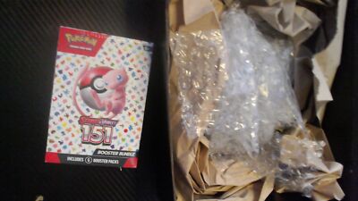 Pokemon 151 Booster Bundle arrived in a box packed with bubble wrap and paper fill